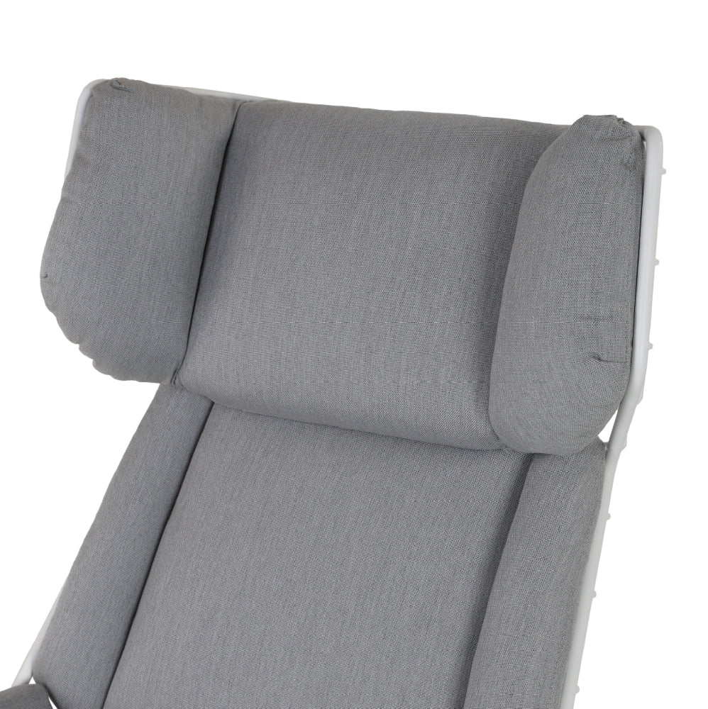 Grey sun lounger with umbrella and table
