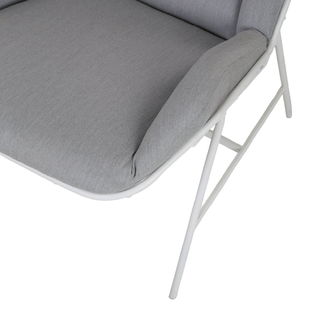 Grey sun lounger with umbrella and table