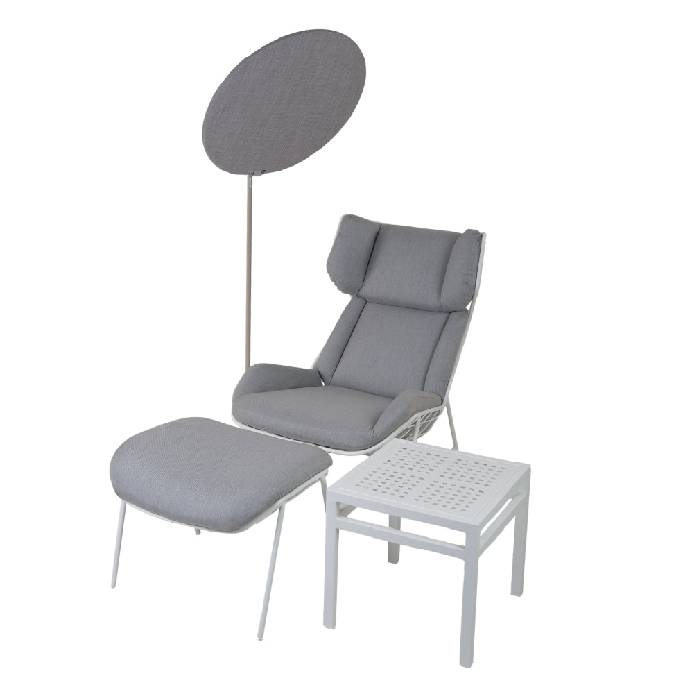 Grey sun lounger with umbrella and table