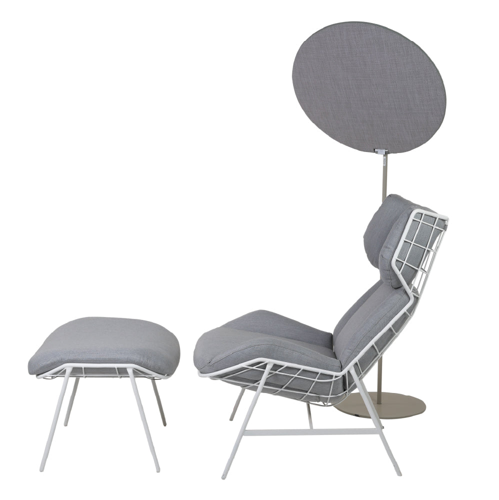 Grey sun lounger with umbrella and table